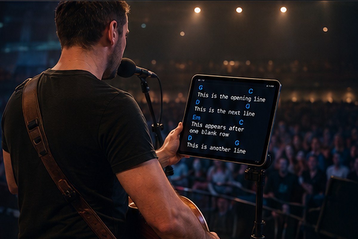 Guitarist reading a tablet teleprompter during a live concert
